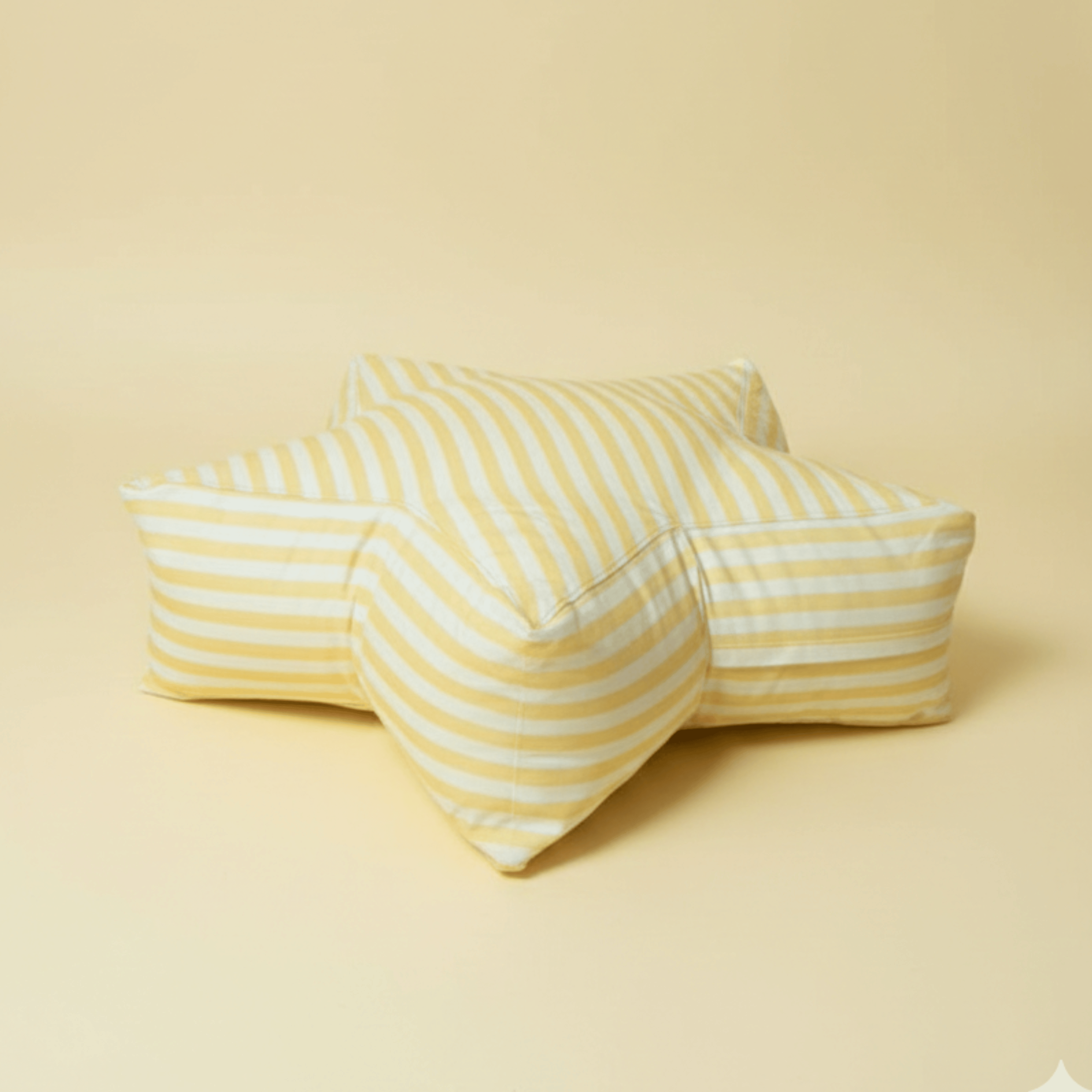 Large superstar floor cushion in a bright, sunny yellow fabric. A 36-inch star-shaped crash pad for kids' reading nooks, available in soft cotton or waterproof oxford.